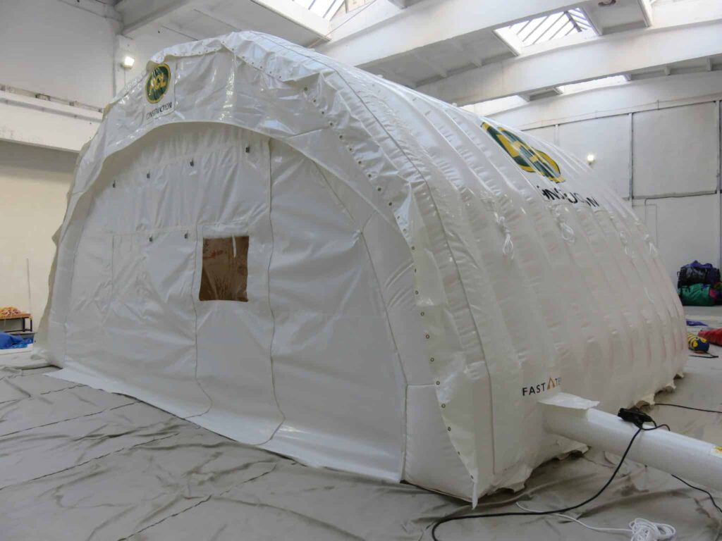 White PCL-branded Njordair Fast Tent deployed for winter construction works in Breckenridge, Colorado
