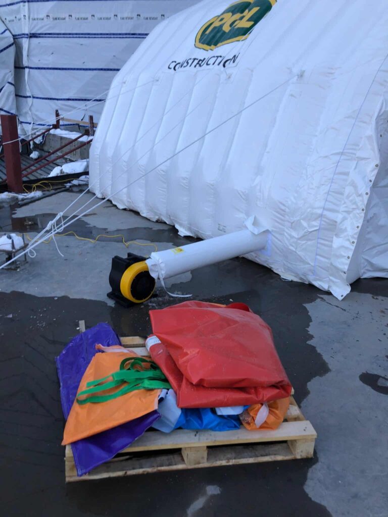 Njordair Fast Tent during set-up with installation equipment staged alongside