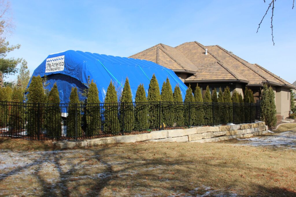 Blue Njordair Constant Air tent enclosing a swimming pool construction site at a Kansas City home