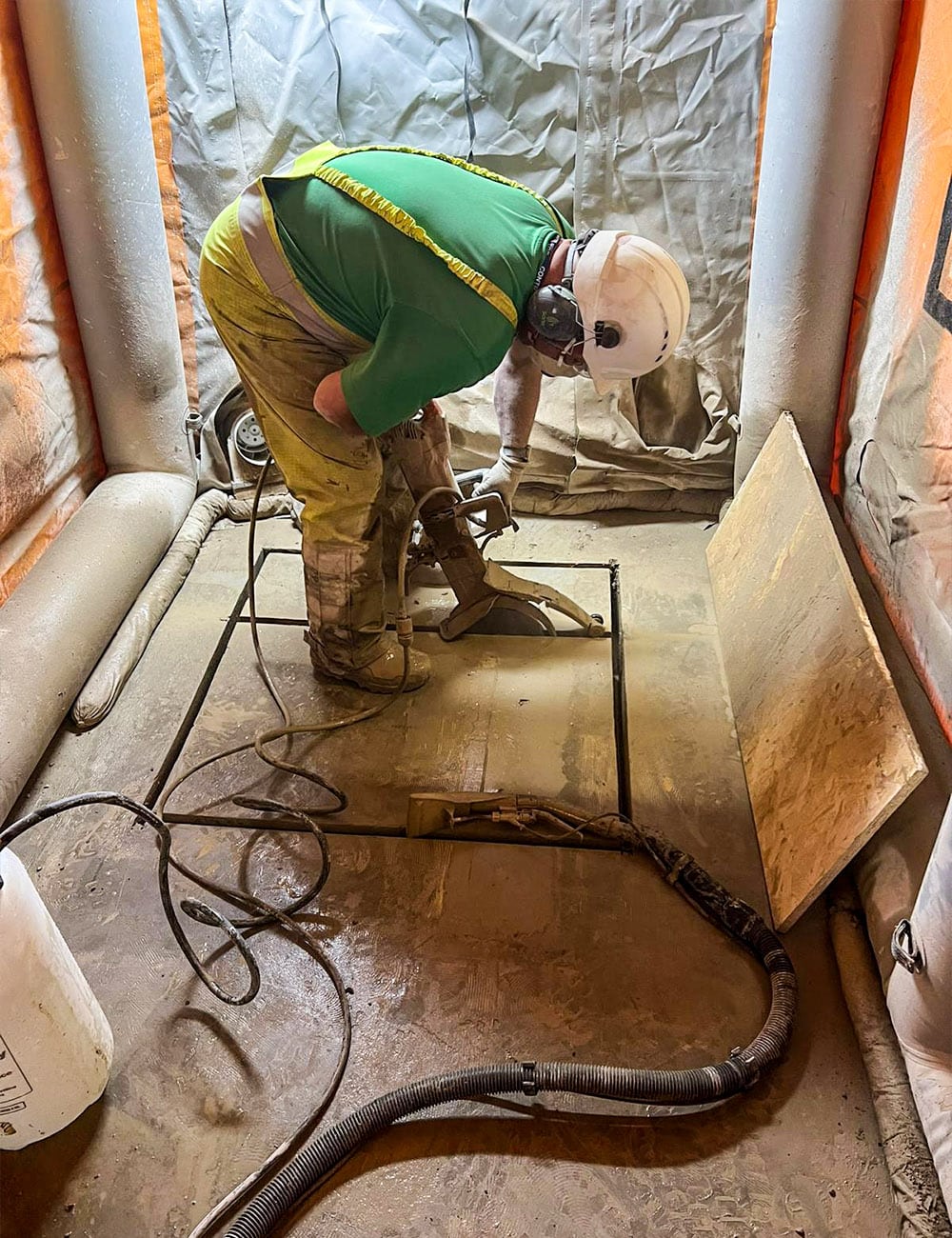 2m sealed-air tent used to contain dust during concrete cutting for new machinery install, keeping facility production areas clean.