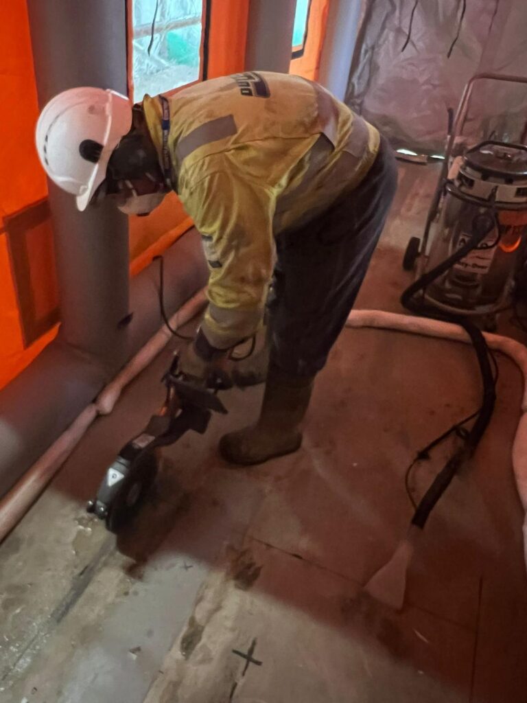 Operative carrying out floor works within the dust-controlled area