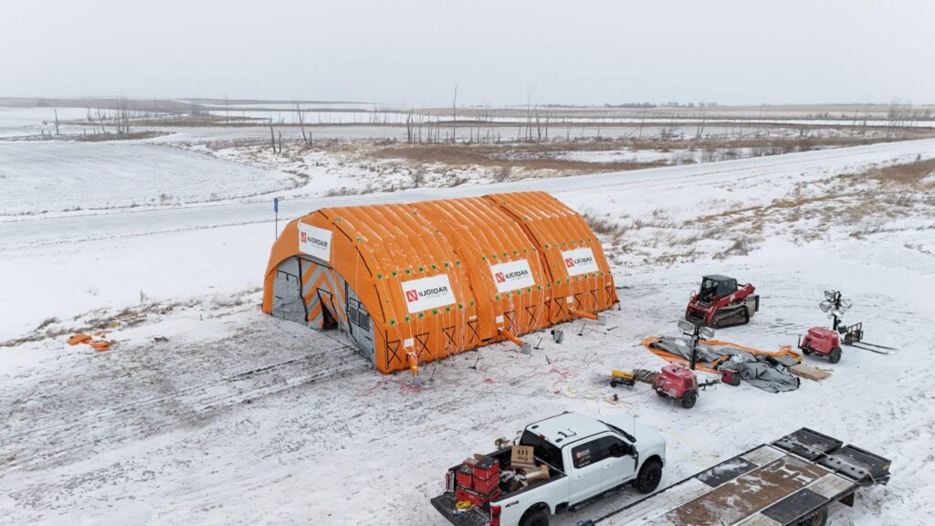 Njordair Constant Air enclosure sealed over a frozen 21,000-gallon frac tank on the North Dakota plains