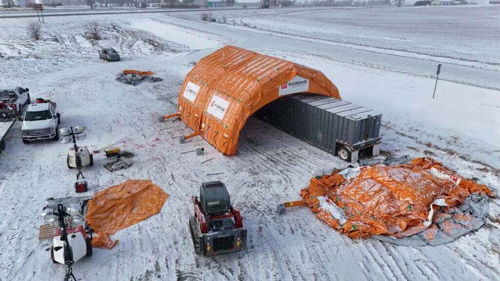 Connected Njordair modules enclosing the frac tank, with a further module laid out for inflation