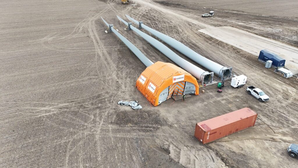 Njordair Fast Tent enclosing wind turbine blades for repair work in Modesto, Illinois